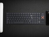 Iqunix Magi96 wireless mechanical keyboard on a desk with other tech