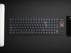 Iqunix Magi96 wireless mechanical keyboard on a desk with other tech