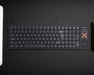 Iqunix Magi96 wireless mechanical keyboard on a desk with other tech
