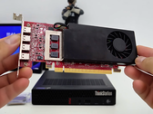 An image of the AMD RX7400 GPU above a Lenovo ThinkStation.