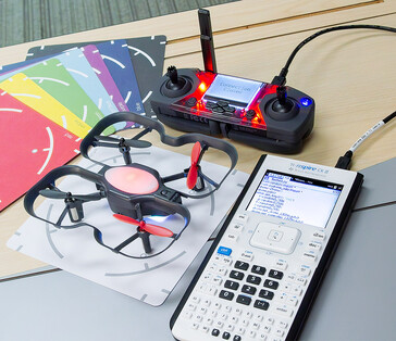 A cable connects the TI Nspire CX II graphing-calculator to the Robolink CoDrone Edu controller for drone programming. (Image source: TI)