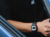 Person wearing the Casio G-Shock DW5600TT25-1 x Toyo Tires watch while seated inside a car.