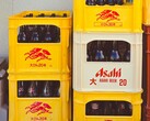Stacked yellow and white plastic crates filled with Asahi beer bottles, featuring Japanese text and red logos. (Image source: Photo by Alazne Lazcano via Pexels)