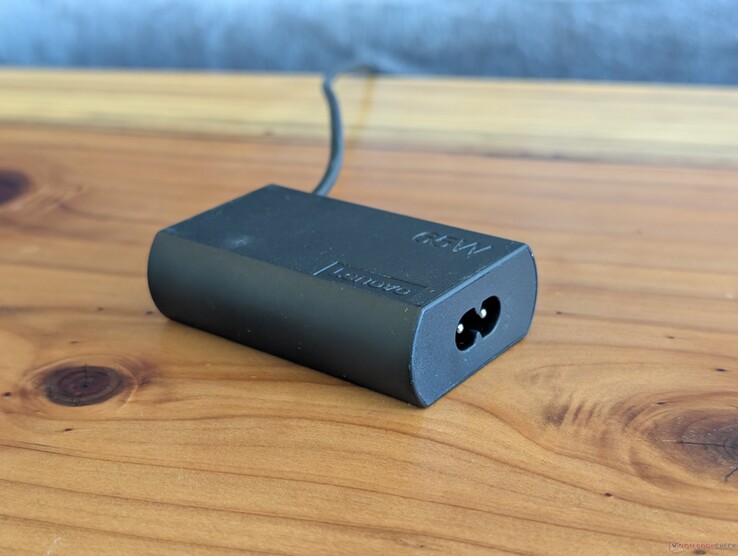 65 W USB-C AC adapter that ships with the Lenovo ThinkPad X1 2-in-1 Gen 11. Note that it requires a second power cable to connect to the an outlet while the USB-C cable is integrated onto the other end