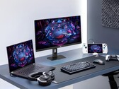 Asus XG27UCMG gaming monitor alongside various Asus electronics