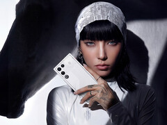 RedMagic 11 Air is confirmed to be powered by the Snapdragon 8 Elite. Pictured: a woman holding the Stardust White color model. (Image source: RedMagic - edited)