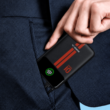 Honor Life power bank with a built-in display shown in a clothing pocket