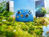8BitDo Rare 40th Anniversary controller with Xbox Series X and Series S consoles in the background. (Image Source: Official 8BitDo promotional poster)