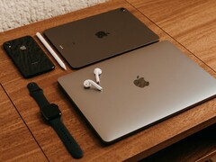 Decorative image. Pictured are two laptops and other consumer electronics laid out on a table (image source: Miguel Hernández via Unsplash; cropped)