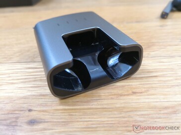 Earbuds removed. Dust and other particles may collect inside of the charging case over time