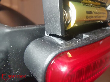 The rear light's battery compartment is damaged, and the light is no longer working