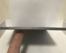 An iPad Pro 2018 user showing the device bent out of shape. (Source: MacRumors)