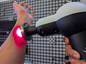 Solbasium S2 massage gun with red light therapy attachment.