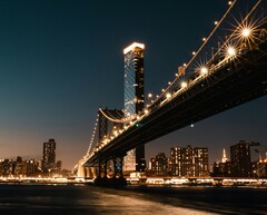 The bright night lights of Manhattan, New York (Image source: Alejandro Luengo/Unsplash)
