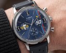 Peanuts® x Timex Marlin® Chronograph worn on the wrist, showcasing a blue dial, perforated blue leather strap, and Snoopy-themed chronograph design.