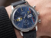Peanuts® x Timex Marlin® Chronograph worn on the wrist, showcasing a blue dial, perforated blue leather strap, and Snoopy-themed chronograph design.