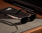 The ROG Xreal R1 come with a dock and they cost $849. Pictured: A promo picture showing the glasses on a table.