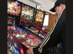 New Zealand pinball machine collector Kim Michael Dozier playing an Iron Maiden pinball Machine at Kimzone