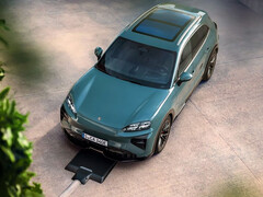Porsche Cayenne EV with its wireless charging pad. (Image source: Porsche)
