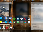 Arrow Launcher running on one of our handsets, showing a homescreen with rotating wallpaper (left), extra options when swipping up on the bottom row shortcuts (middle), and the quick cards screen (right). (Source: Own)