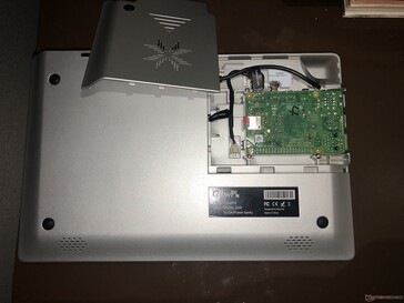 Bottom: Access panel (removed) to expose bottom of Raspberry Pi.