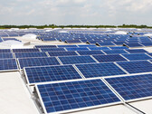 A solar panel array stacked on multiple roofs