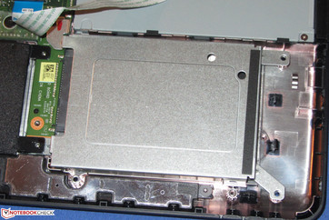 It is easiest to remove the adjacent board before adding a 2.5-inch drive.