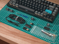 Keychron Q1 Ultra accessories — including extra screws, gasket mounts, and a screw driver and Allen key to disassemble the keyboard. 