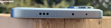 Top: speaker, IR blaster, microphone