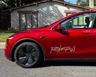 Tesla Robotaxi ride-share platform logo on a Model Y.