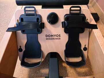 The height of the footrest is adjustable and the feet are secured with straps.