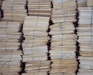 Tall stacks of bundled paper files, tied with string