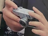 Hands-on image of the Fujifilm XHalf compact camera. 