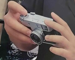 Hands-on image of the Fujifilm XHalf compact camera. 