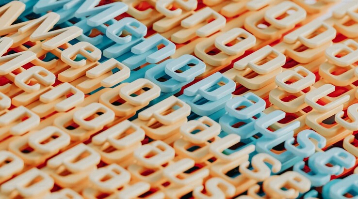 Abstract representation of the word menopause using colourful 3D letters (Image source: A.C. via Unsplash)