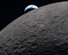 The lunar surface fills the frame in sharp detail, as seen during the Artemis II lunar flyby, while a distant Earth sets in the background.
