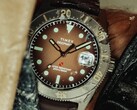 Huckberry x Timex Deepwater Reef 200 dive watch with a brown dial, stainless steel case, black bezel, and matching brown strap.