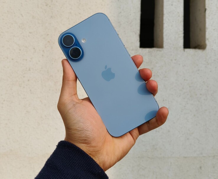 Rear design of the Apple iPhone 16 in blue, showing dual camera layout and glass back (Image source: Yetnesh Dubey)