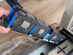 Eight Apple M5 board populated on a single carrier bar, part of a larger server blade