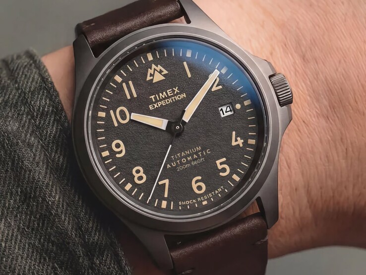 Timex Expedition Field Post Titanium watch worn on a wrist, showing its black dial and black titanium case.