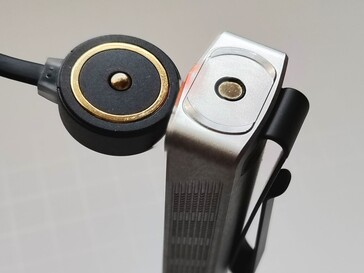 The Olight ArkPro Stars & Stripes flashlight can be recharged with the included magnetic charging pad.