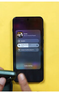 The audio-sharing interface on a OnePlus phone showing two connected pairs of wireless earbuds available for simultaneous audio playback.