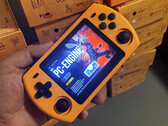A picture of a Powkiddy P36S retail unit in its orange finish.