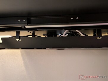 Full length cable organizer tray with passthrough holes.