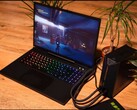 XMG Neo 15 laptop connected to an external water cooling unit while running the game Control. (Image source: XMG/Reddit)