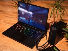 XMG Neo 15 laptop connected to an external water cooling unit while running the game Control. (Image source: XMG/Reddit)