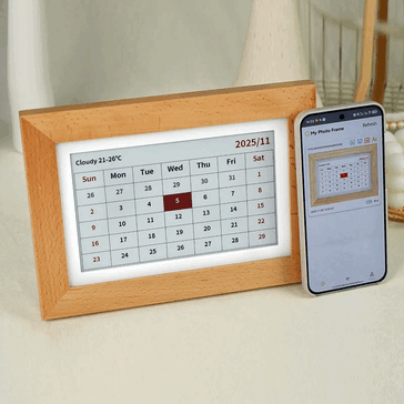 Bigme digital photo frame displaying a calendar beside a smartphone.