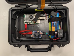 Raspberry Pi, battery, and other components inside the case.