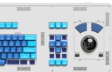 Without the magnetic top panel, we can see the key-switch slots and the trackball circuit that  simply snaps into place (Image source: Atomic)