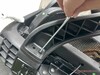 Install the armrests using two screws each